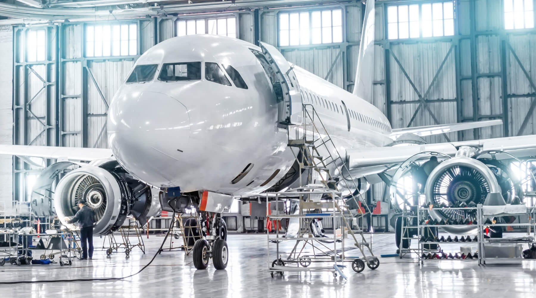 new jet aircraft being assembled in a hangar